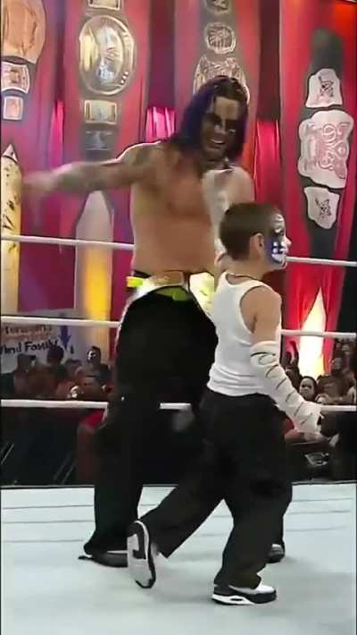 Jeff Hardy celebrating with a kid after winning his last world title in WWE (WWE NOC 2009)