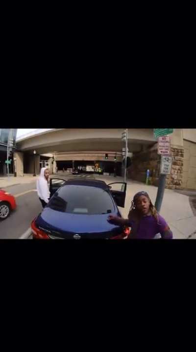 Racist couple gets mad at longboarder for calling them out for taking up the bike lane