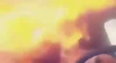 Guy enjoing so munch music he puts fire in his car
