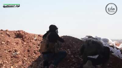Turkish-backed Syrian Liberation Front fighters use an eclectic mix of weapons against IS positions near Tlaline, Syria - 2016