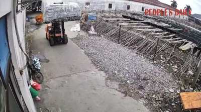 Big sister stops forklift to make sure younger siblings are out of the way