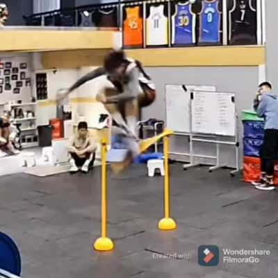 Dude jump over a bar