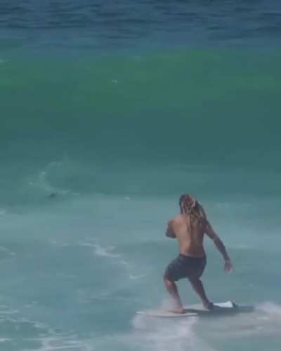 This dude skimboarding