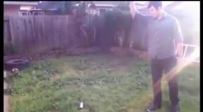Idiot uses paint can as knife throwing target