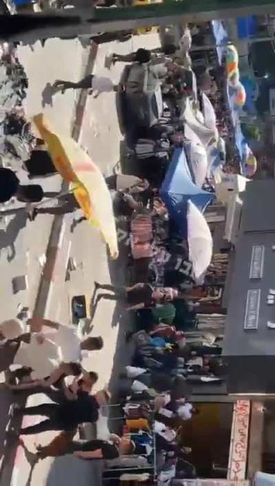 A crowd fights for no apparent reason