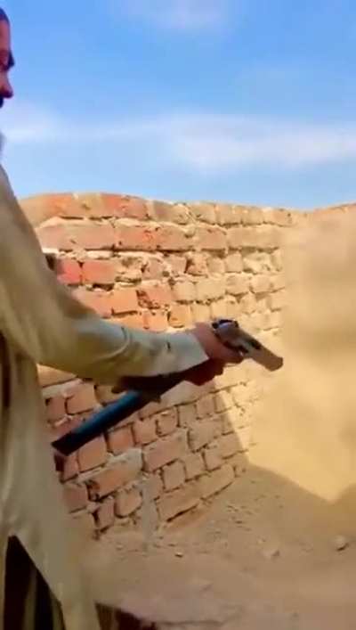 Pakistani with a very long magazine for a pistol (full auto)