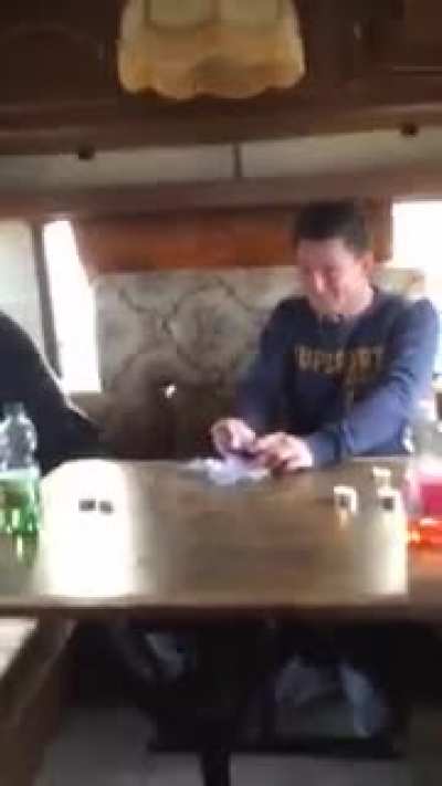 These guys are attempting to eat Surströmming fish, the probably worst smelling fish there is