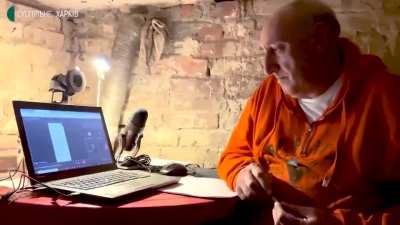 A lecturer from Kharkiv University shows how he continues his online lectures in his basement to ensure safety during missile attacks
