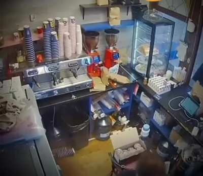A Russian missile impacts near a Ukrainian cafe (safe for work)