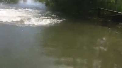 Me riding a bike into a lake