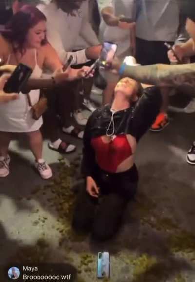 Girl on 6th street in Texas covers herself in horse crap