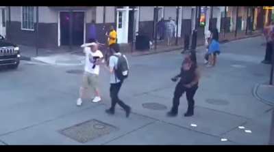 Edgy Livestreamer walks up to a woman in New Orleans and uses a racial slur. Gets hit over the head. Plays the victim afterwards.