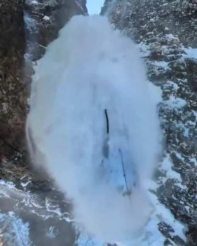 This guy got caught on a frozen waterfall