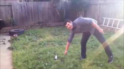 Guy throws a knife at a spray can