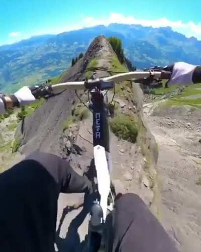 Biking on a very narrow and dangerous cliff