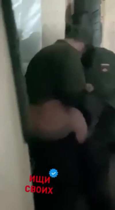 NSFW: A Russian disciplinary officer actually committed assault on a newly immobilized soldier who was reluctant to deploy to the front lines.