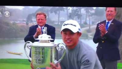 PGA Champion Collin Morikawa hoists Wanamaker Trophy in victory.