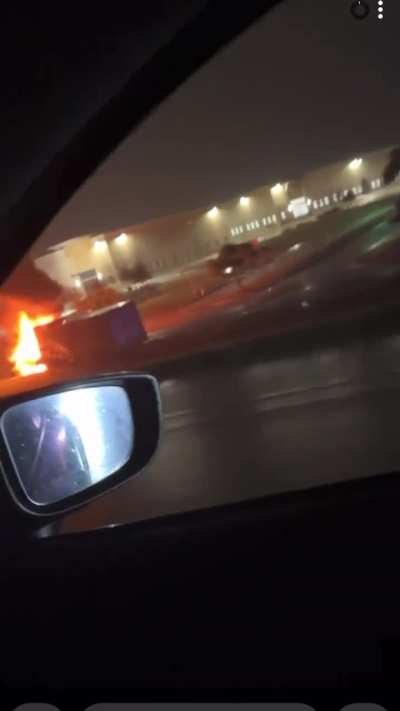 Cab of 18-Wheeler catches fire after rolling onto access road