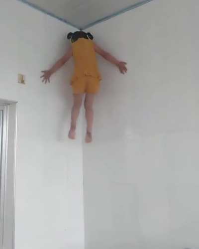 Girl climbing the wall like a spider