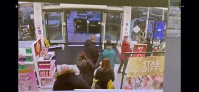 Car drives through shop front in Liverpool, UK.
