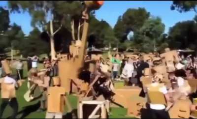 Each year in an Australian park, hundreds of people bring their handmade cardboard creations to battle in a giant cardboard war known as 