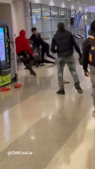 Airport melee but with 'What a wonderful world' as background music