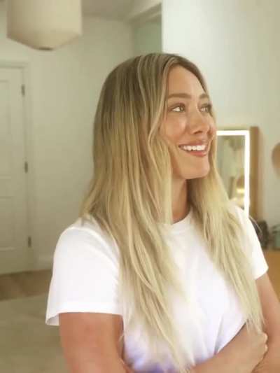 Smiling Hilary in white tee - IG August 2025