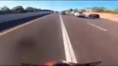 Idiot on a bike splitting lanes at well over 100mph.