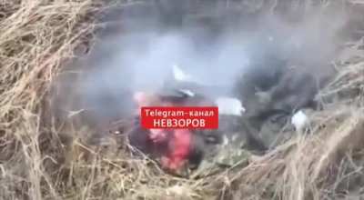 [Archive Footage] Russian soldier gets folded in half after a grenade gets caught under his vest. April 2024