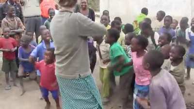 Joy of children hearing a fiddle for the first time