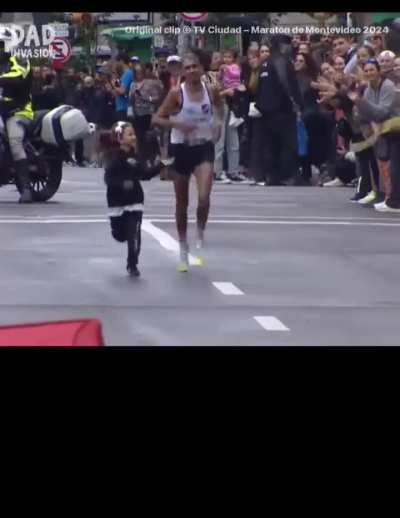 Marathon winner Alexis Castro was exhausted in the final stretch, until his daughter ran out to help him finish the race hand-in-hand.