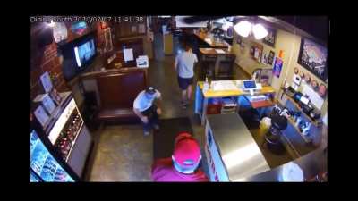 Told to wear a mask at Kansas City area BBQ restaurant, man in MAGA hat flashes a gun.