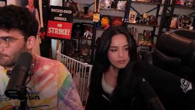 rae nearly falls off chair
