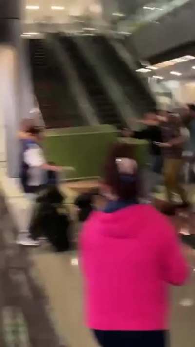 Brawl tonight at Miami airport, officer pulls gun