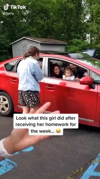 Little girl has the best reaction to receiving her homework from her teacher