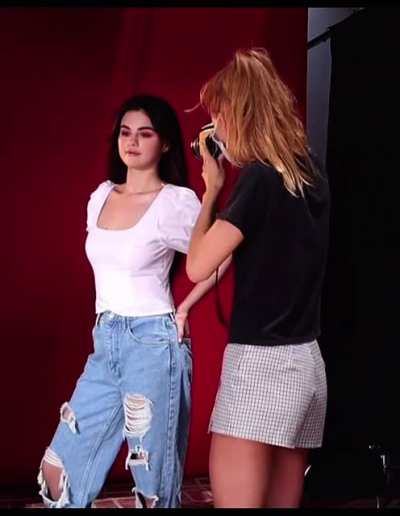 Selena, look over there, smile. At least stick out your chest..