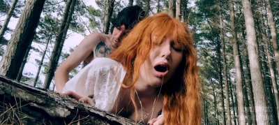 Redhead gets bent over and stretched out during hike