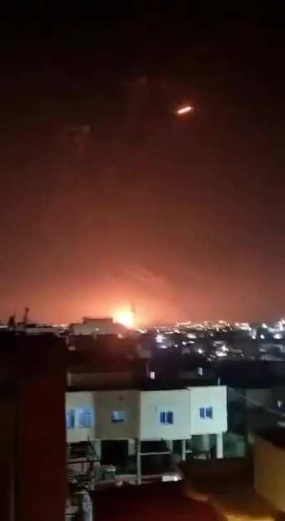 A night battle between Israel's missile defense and Iranian missiles.