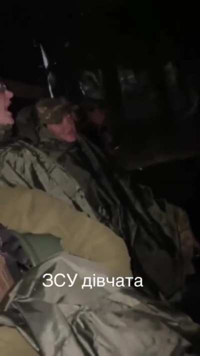 Female Ukrainian soldiers are cheering themself by singing