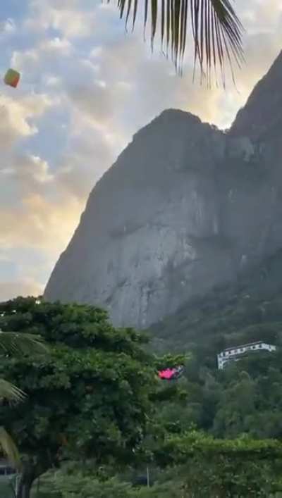 Guy releases parachute then opens another one mid-air.