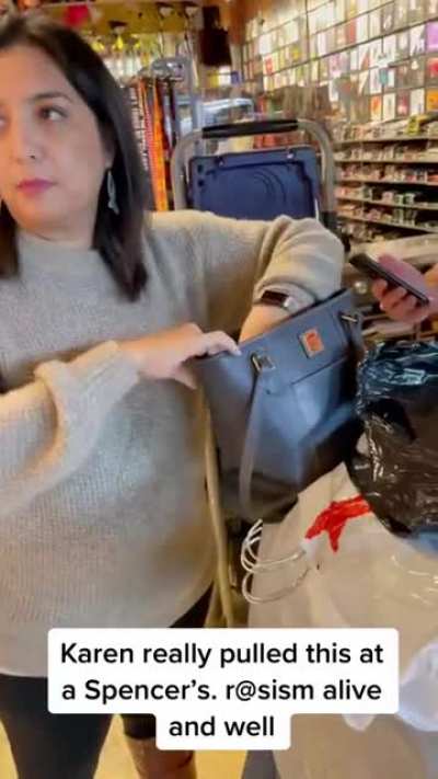 Woman at Spencer’s can’t find her phone and accuses a Black man behind her of stealing it, then finds it in her purse