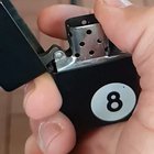 Slow motion of a lighter being turned on