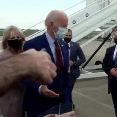 Jill Biden pulls her husband back a few feet