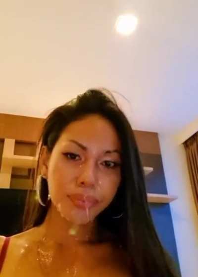 Asian cumslut dumps a cup of cum on her face