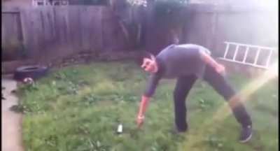 Guy throws knife at spray paint