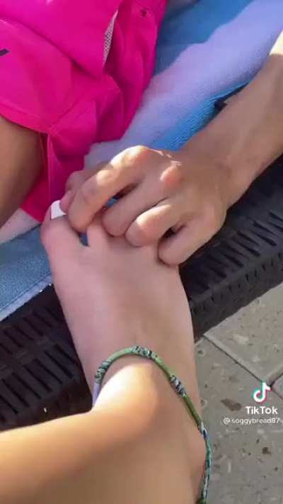 holding her feet