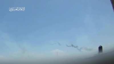 Hamas firing rockets barrage into Kerem Shalom - applause and cheering heard in background
