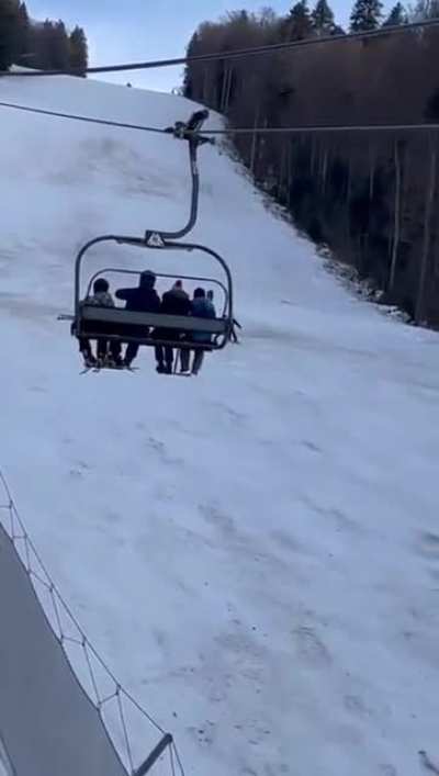 A bear chasing a skier