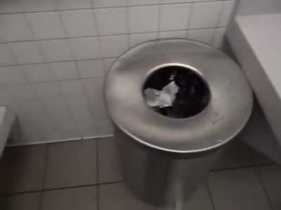 Dude pissing all over a (presumably public) bathroom. Wtf