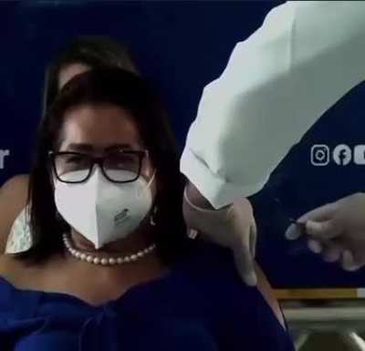 Brazilian politician gets the covid-19 vaccine live on TV. Wait...........